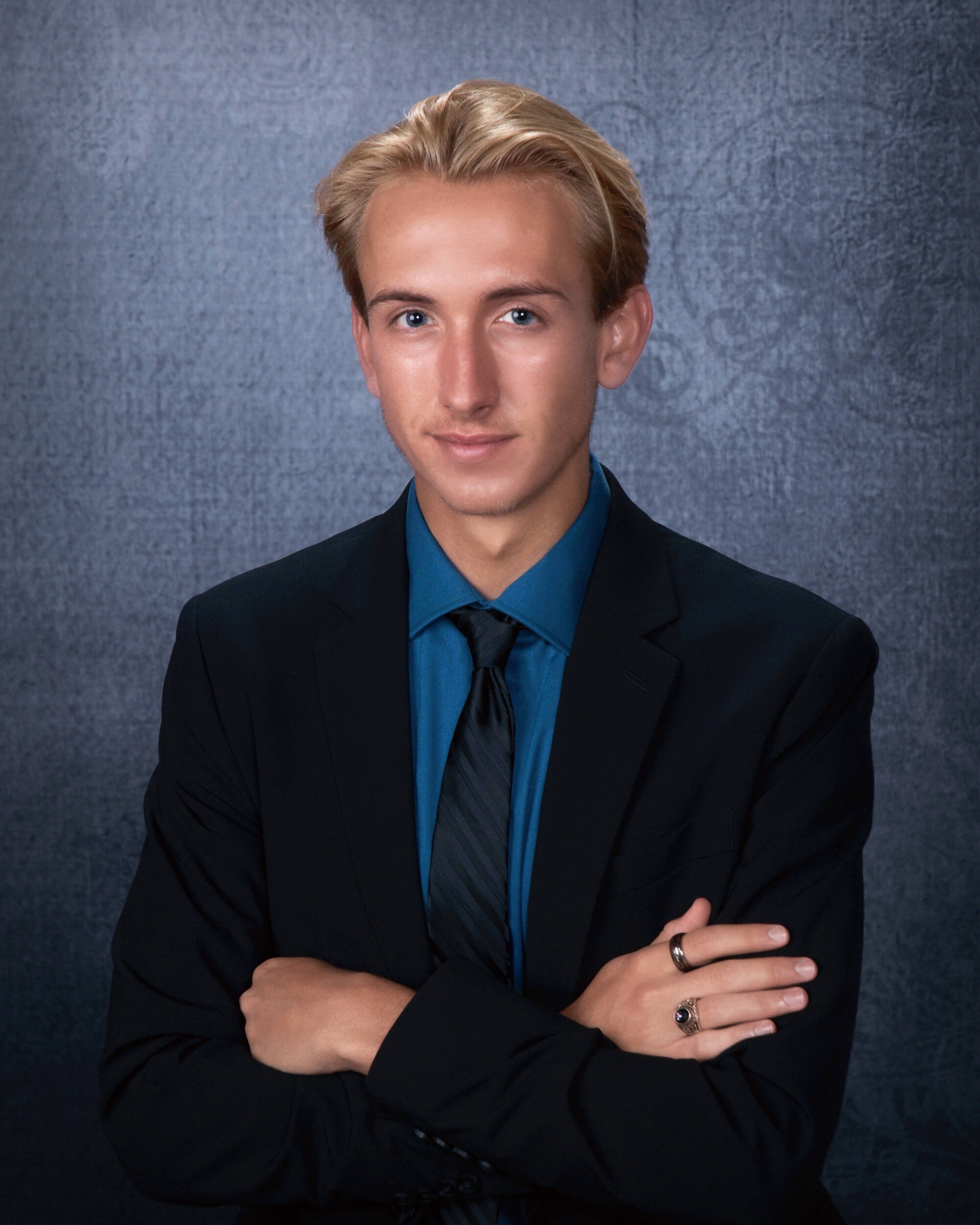 2026 PCE graduate Kyler Cope, pictured in a suit and tie